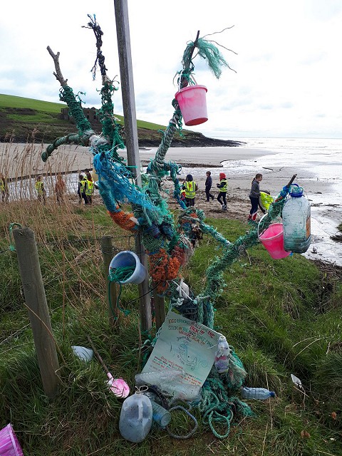 Trash tree with ecobricks and buckets